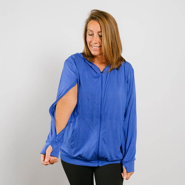 #NEW Woman wearing a blue jacket with cut-out design on a plain background | Model is 5'3" 130lbs wearing size S