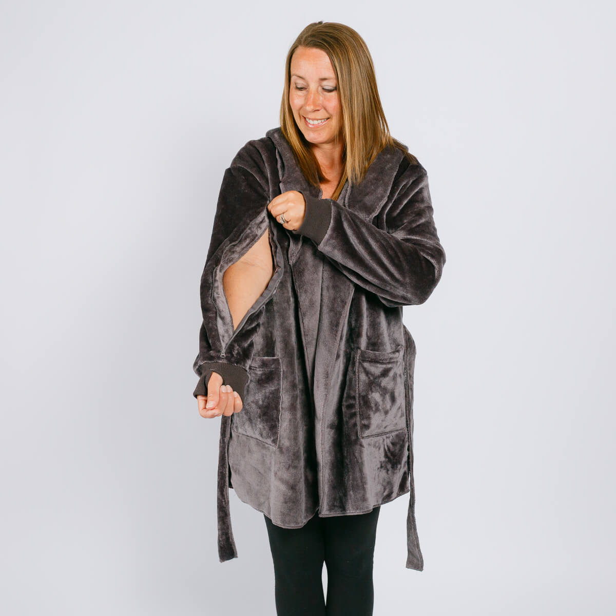 Woman wearing a gray velvet hooded robe over black leggings against a white background. #NEW | Model is 5'3" 130lbs wearing size S