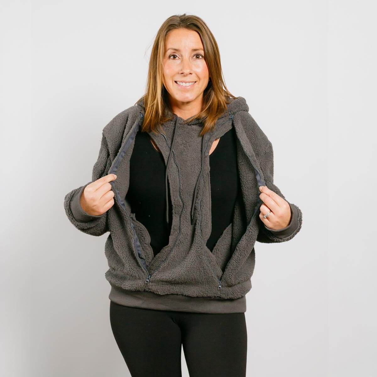 Woman wearing a gray fleece-lined hooded jacket on a white background #NEW | Model is 5'3" 130lbs wearing size S