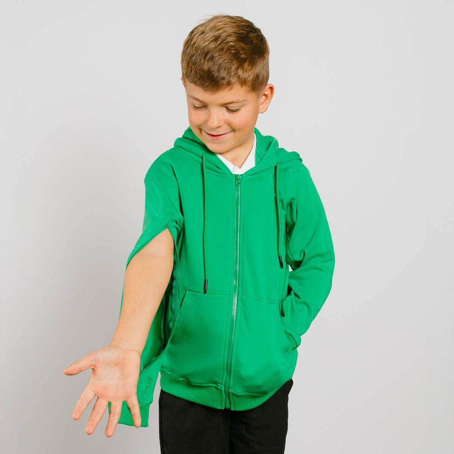 Young boy wearing green IV zip hoodie with left sleeve zipper access open.