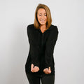 Woman wearing black bamboo IV zip hoodie with accessible arm openings, front view.