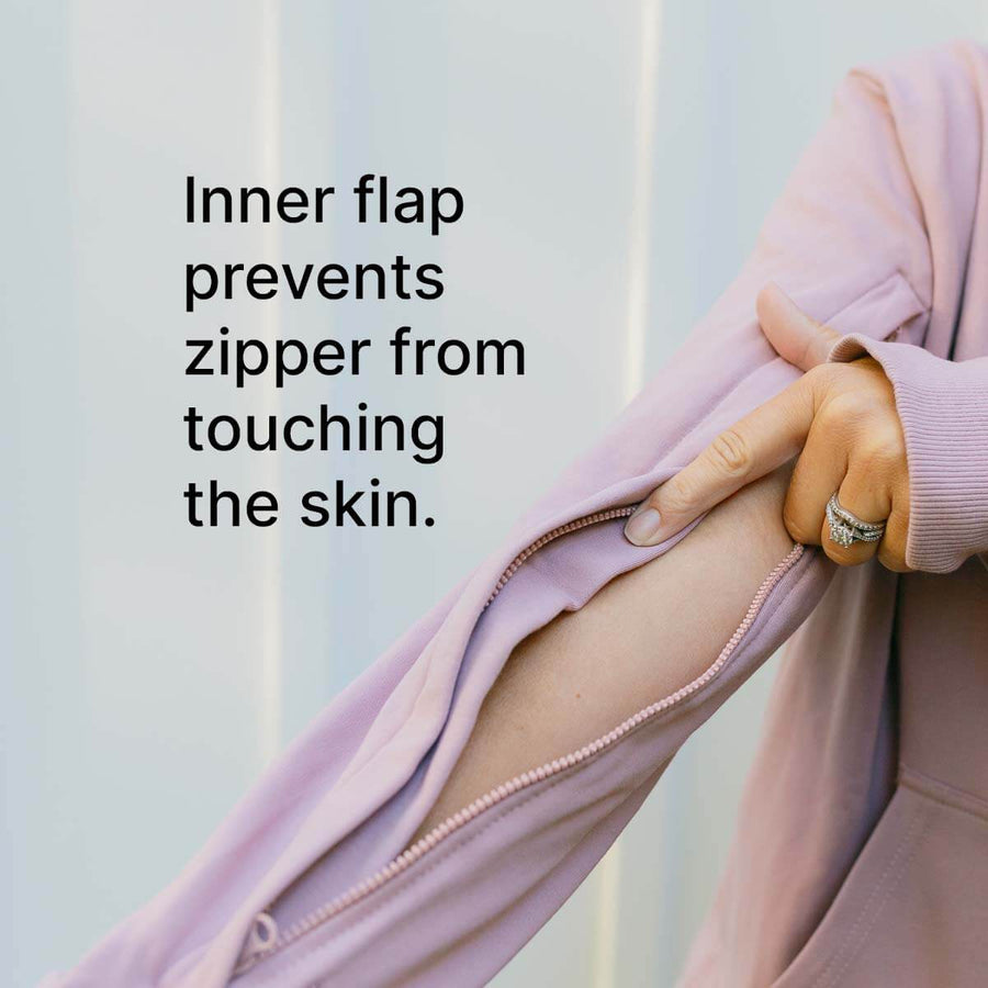 Close-up of lavender IV zip hoodie showing inner flap protecting zipper from skin contact.