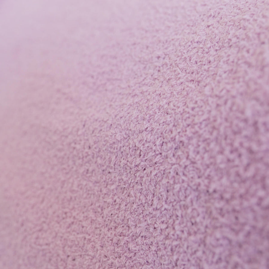 Close-up of lavender infusion day blanket's soft, textured fabric surface.