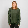 Woman wearing olive green IV crewneck sweatshirt, front view.