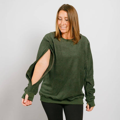 Woman wearing a green sweater with cut-out sleeves against a plain background #NEW | Model is 5'3" 130lbs wearing size S