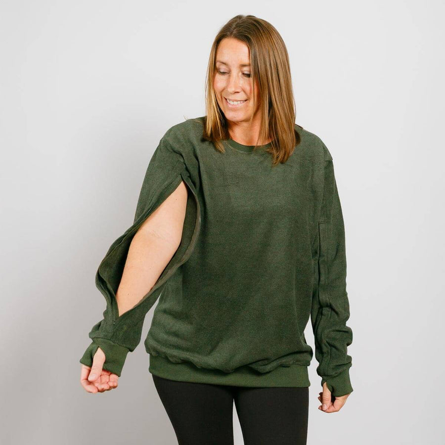 Woman wearing a green sweater with cut-out sleeves against a plain background #NEW