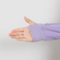 Person wearing lavender IV zip hoodie with left sleeve port access zipper visible.
