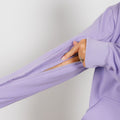 Person wearing lavender IV zip hoodie with side zipper open, demonstrating arm access feature.