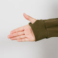 Person wearing olive green IV zip hoodie with left arm zipper access detail visible.