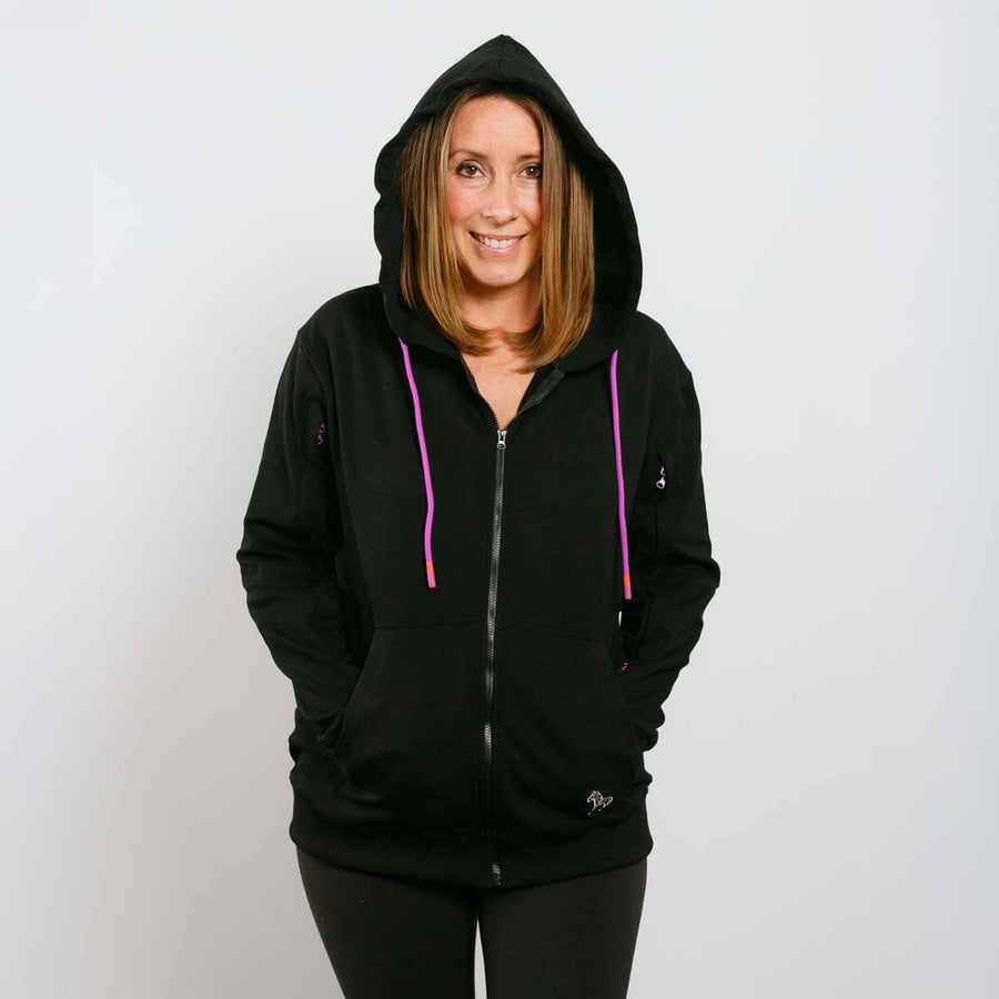Woman wearing black IV zip hoodie with purple drawstrings, front view.