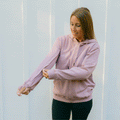 Woman wearing lavender IV zip hoodie with sleeve zipper access feature  visible.