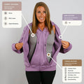 Woman wearing purple zip hoodie demonstrating chest, arm, and torso access points for medical ports and catheters.