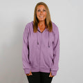 Woman wearing a purple zip-up hoodie with drawstrings over black pants against a white background.