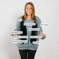 Woman wearing light blue crewneck sweatshirt with labeled medical equipment and care devices printed across chest and torso.