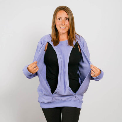 Woman wearing light purple zip-up hoodie over black shirt, demonstrating open front access pockets. | Model is 5'3" 130lbs wearing size S