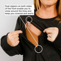 Woman wearing black crewneck with dual front zippers demonstrating chest access opening.