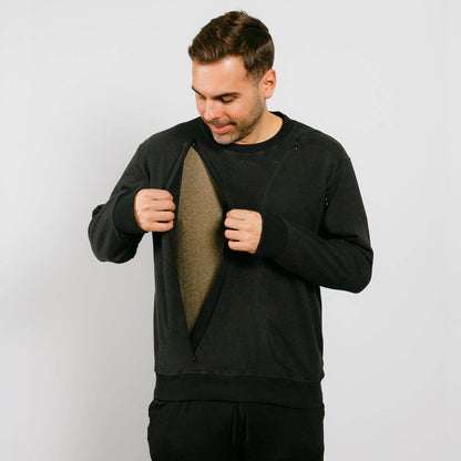 Man wearing a black outfit with a plain background | Model is 5'8" 165lbs wearing size M