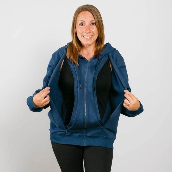 Woman wearing a blue zip-up hoodie over a black top on a plain white background  #NEW  | Model is 5'3" 130lbs wearing size S 