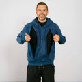 Man wearing a dark  blue hoodie opening both sides of the front via zip up holes with a plain background | Model is 5'8" 165lbs wearing size M