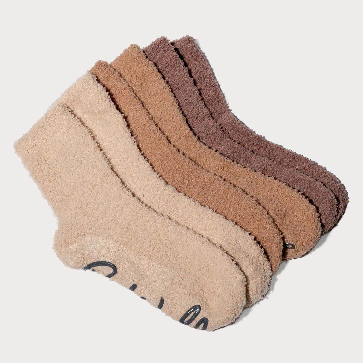 Three pairs of socks in beige, brown, and another shade of brown on a light gray background. #NEW