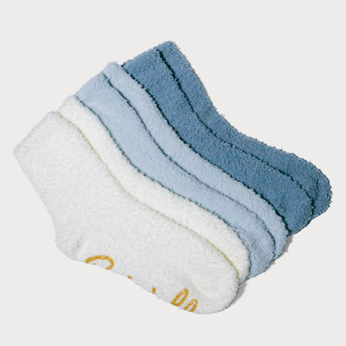 Pair of blue and white baby socks on a light gray background #NEW
