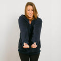 Woman wearing navy sherpa zip hoodie with front view showing full garment fit.