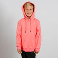 Young child wearing a bright pink hoodie with drawstrings and black pants, smiling at camera.