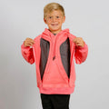 Young boy wearing a bright pink hooded sweatshirt over a gray shirt, smiling at camera. | Model is 4'1" 58lbs 7 yo,  wearing size YS